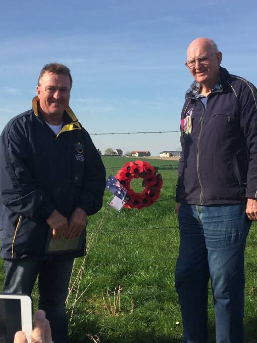 RESPECT: Nowra RSL Sub-Branch secretary Rick Meehan and Brian Kenny lay a wreath when Mr Kenny's uncle Bede was awarded the Victoria Cross.