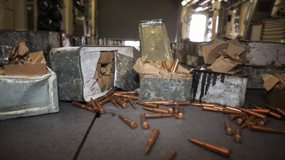 HMAS Ballarat seized nearly half a million rounds of small arms ammunition and 697 bags of chemical fertiliser for possible dual use in the manufacturing of improvised explosive devices. Photo: Bradley Darvill