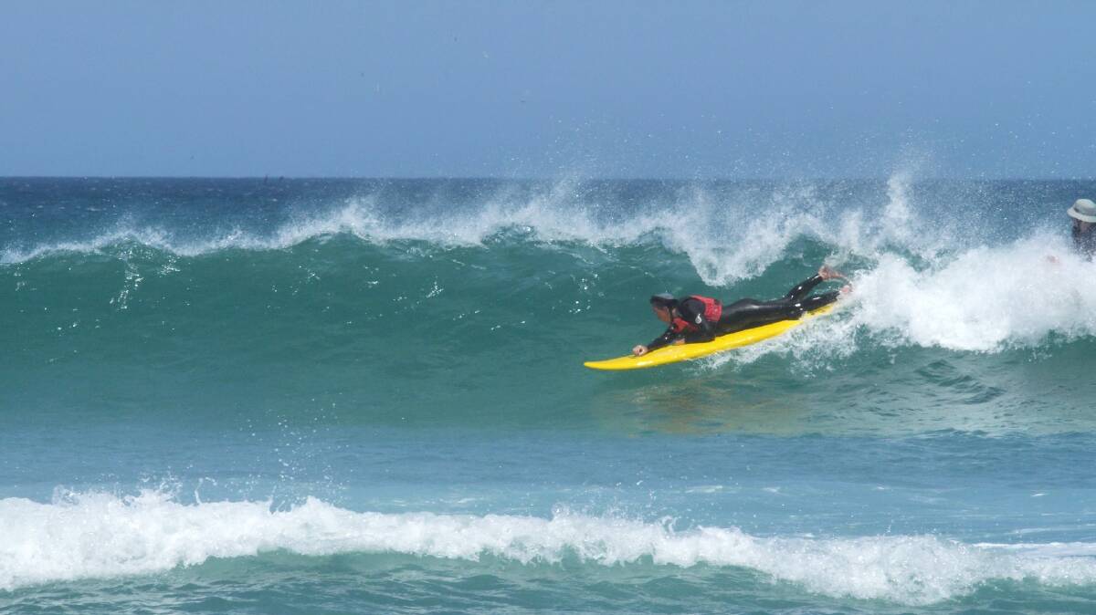 WOOHOO: Steve Preston catches a wave. Image: James Kates