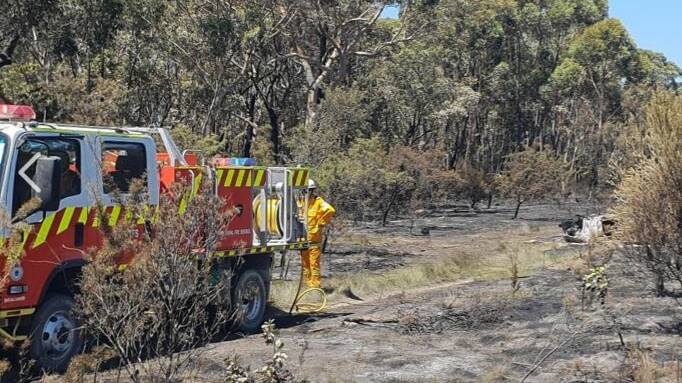 FIRE: Rural fire service crews attended bushland west of Tomerong where a luxury car, later identified as a Maserati, was burnt out. Photo: Tomerong RFS