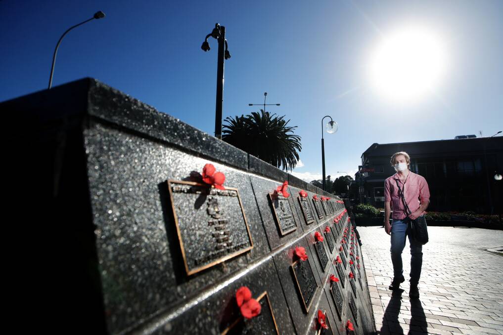 HISTORY BUFF: Joe Edwards is partly behind a new history tour taking walkers back in time to World War I - shown above at the Gordon Grellman Wall of Remembrance in Kiama. Picture: Sylvia Liber