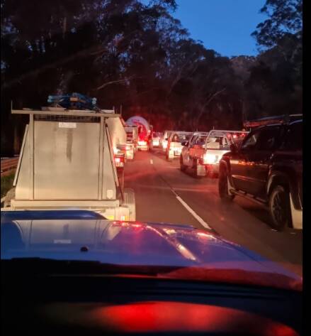 A long queue forms after a truck forces the closure of Macquarie Pass on Monday morning. Picture: Facebook