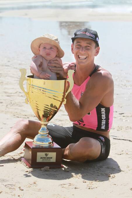 HOW GOOD: Series champion Ali Day with son Danny and the championship trophy. Picture: SLSA