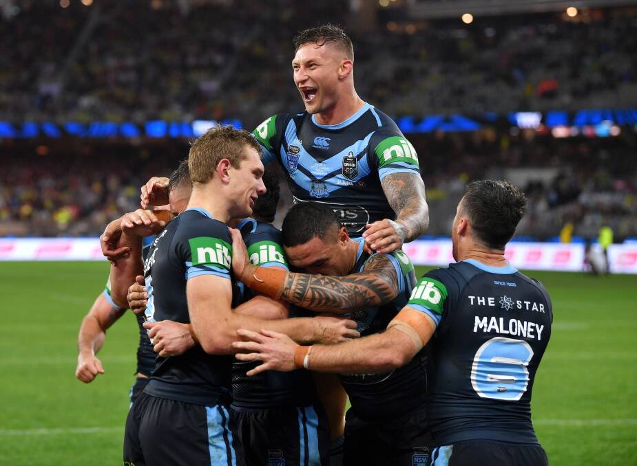 Tariq Sims and his NSW team mates celebrate Tom Trojevic's second try. Photo: NRL Photos
