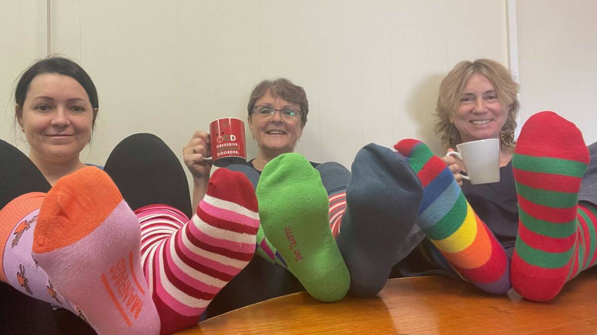 Kylie Cochrane, Teena Mitchell and Jo Young from GROW Australia are encouraging people to wear some Odd Socks on October 6 to help stamp out stigma around mental health. Pictures supplied. 