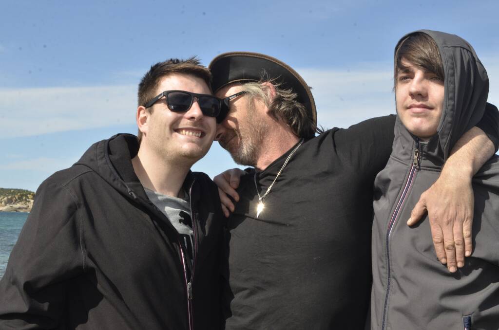 LOVE MY KIDS: Missing and now found fisherman Derek Robinson with his two boys Ashley and Tim after making landfall at Victor Harbor on Thursday. Photo The Times