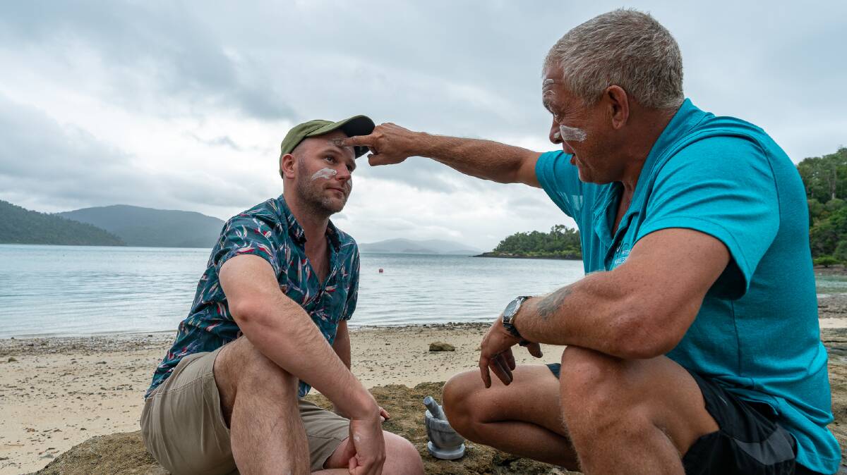 Peter Pryor welcomes Michael Turtle as part of the Whitsunday Paradise Explorer cultural tour.