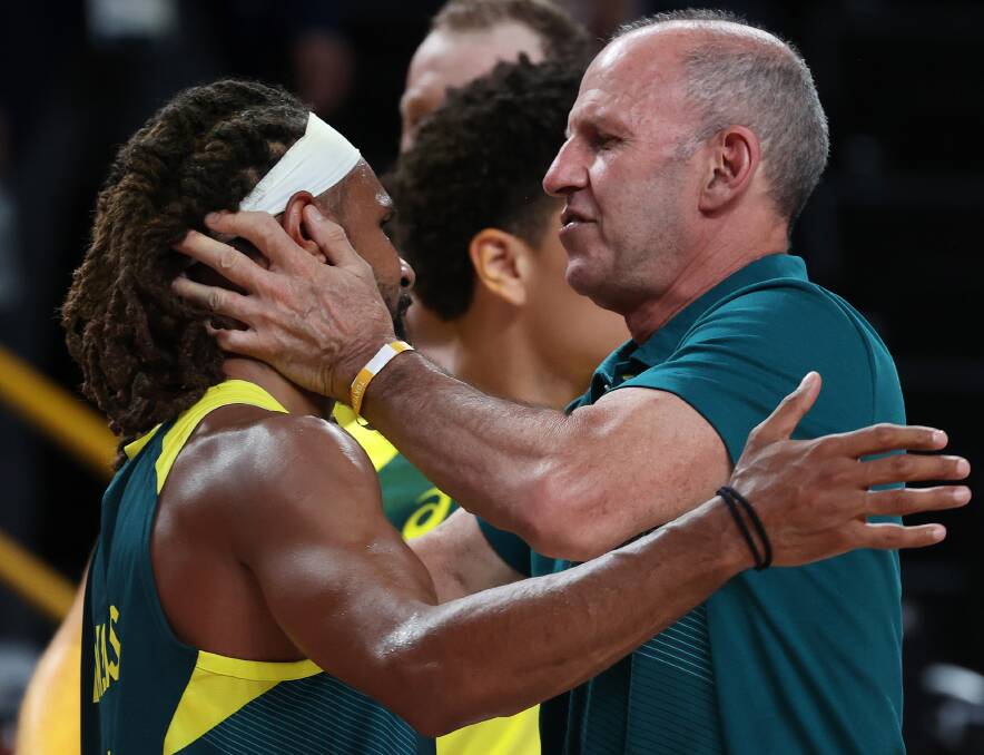 Patty Mills with Boomers coach Brian Goorjian after winning a bronze medal. Photo: Kevin C. Cox
