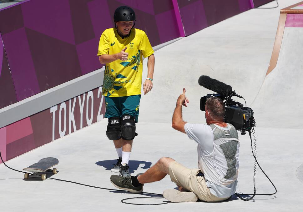 You OK, mate: Skateboarder Kieran Woolley checks on the cameraman after crashing into him during competition in Tokyo. Photo: Jamie Squire
