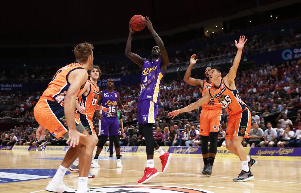 Deng Deng takes on Cairns while playing for the Kings last year. Photo: Matt King