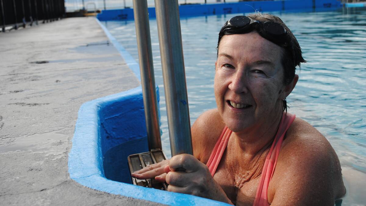 Michele Thompson makes the most of the warmer weather using the Ulladulla Sea Pool during its winter trial.