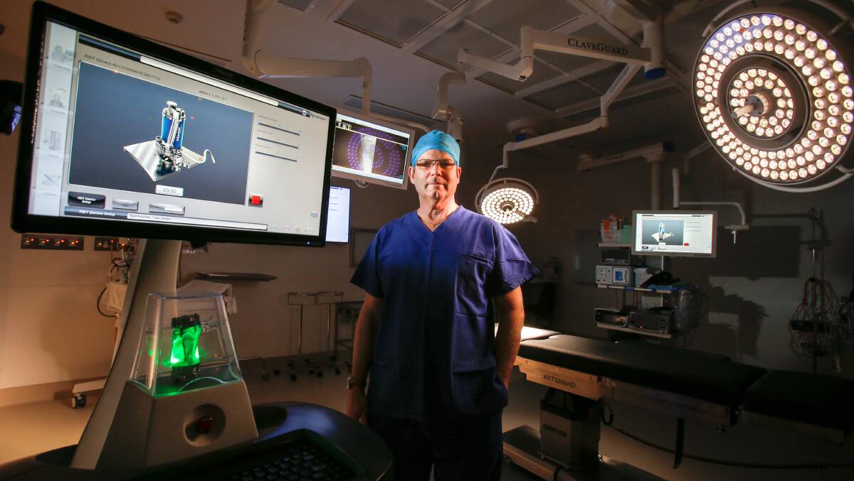 Dr Day, pictured with Wollongong Private Hospital's Mazor Robotics Renaissance Guidance System in November 2016. Picture: Adam McLean 