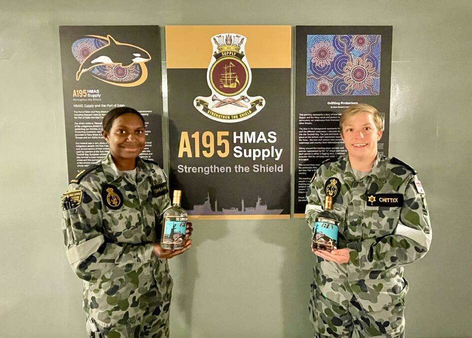 HMAS Supply crew members with The Commissioning Gin. Photo supplied