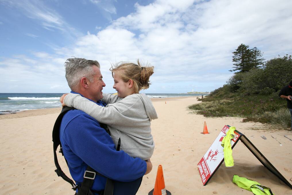 Founder of the Great Cop Drop, Detective Inspector Darrin Batchelor with his daughter Isla at North Wollongong on Sunday. Picture: Adam McLean