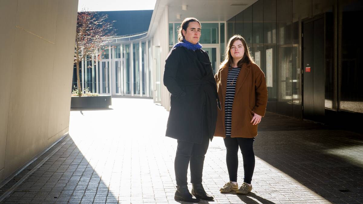 ANU postgraduate students, Zoë Tulip and Tess Boylen are worried about HECS debt now the threshold has been lowered. Picture: Elesa Kurtz