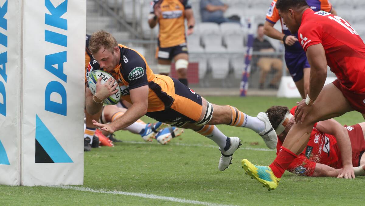 Berry's Will Miller dives over for a try for the Brumbies on Friday. Photo: Robert Peet