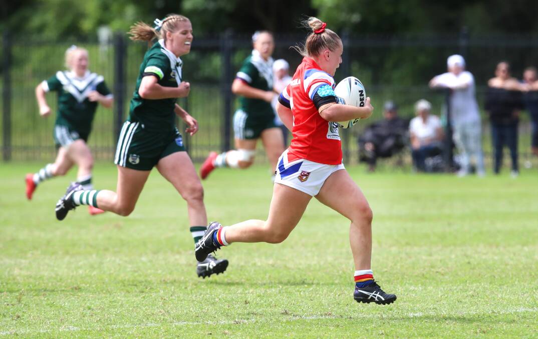 Albion Park-Oak Flats' Brittany Constable en route to her 80-metre try on Sunday. Photo: Sylvia Liber