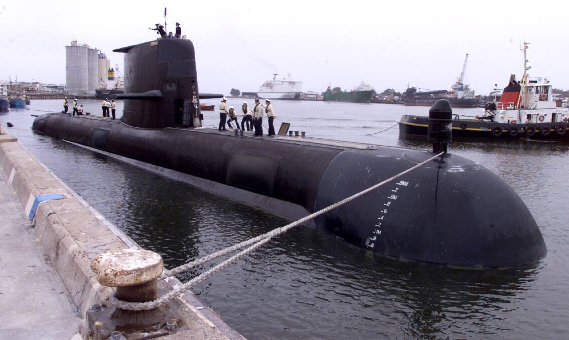 The 'Aukus' submarines would eventually replace Australia's diesel-powered Collins class vessels such as HMAS Farncomb, pictured here in Devonport, Tasmania.