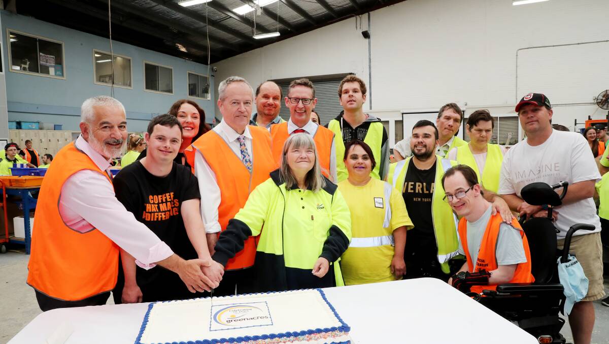 Greenacres CEO Chris Christodoulou, left, and NDIS Minister Bill Shorten, third from left, Greenacres employees and MPs Alison Byrnes and Stephen Jones. Picture by Sylvia Liber