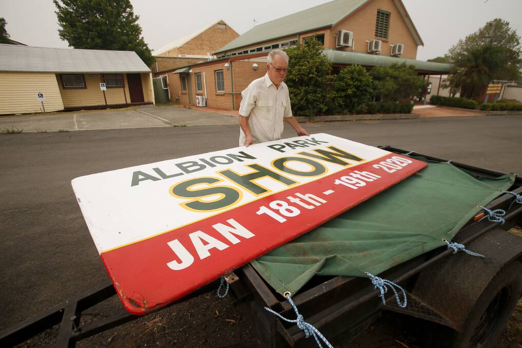 Albion Park AH&I Association committee member Ray Price packs up the signs for the 2020 show. 