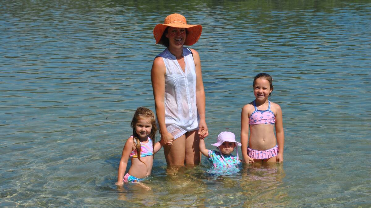 COOLING OFF: Anneliese, Katie, Mila and Evie Graham of Narrawallee cooling off at Narrawallee Inlet. 