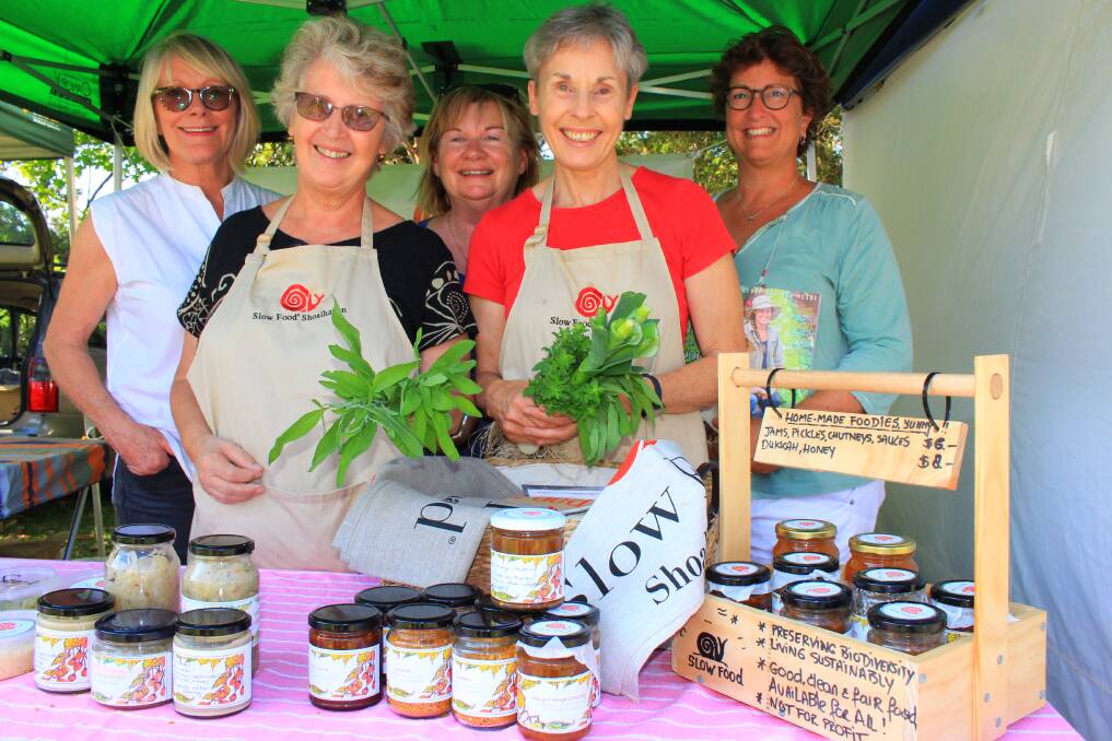 TAKING IT SLOW: Slow Food Shoalhaven leader Rosie Cupitt (back left) with members Linda Hatch, Marianne Cool, Shelagh Atkinson and Evelyn May at the Gaia Farmer's Market in Ulladulla. 