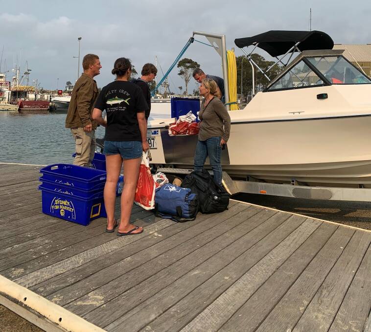 Emergency supplies being loaded onto a private boat at Ulladulla Harbour bound for Bawley Point, funded by the GoFundMe appeal. Picture: Supplied