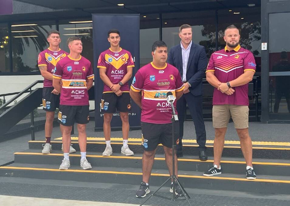 Shellharbour Sharks coach Abed Atallah (front) with his players and a representative of Smart Financial and Mental Health Movement founder Dan Hunt, ahead of the Shellharbour Sharks RLFC shootout tournament at Ron Costello Oval on Saturday, March 2. Picture supplied 
