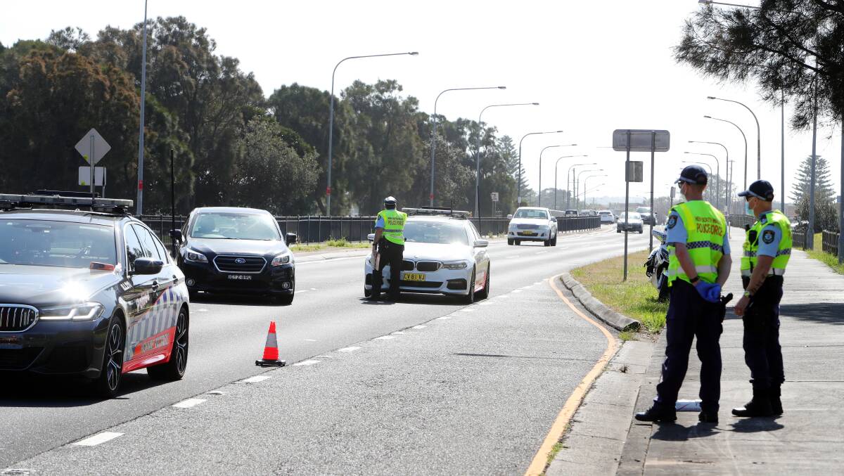 OUT IN FORCE: Police busy conducting conducting compliance checks in the Illawarra. Picture: Sylvia Liber