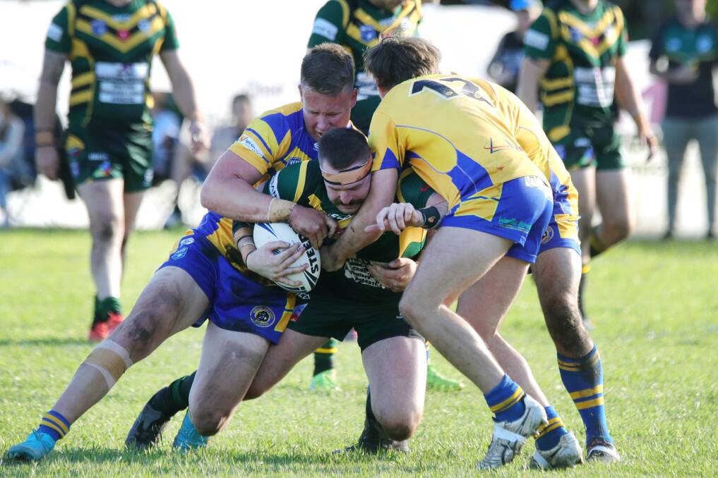 NEW RECRUIT: Tom Warner (being tackled) has been one of the Stingrays' best players since joining the club from Albion Park this season. Picture: Sylvia Liber