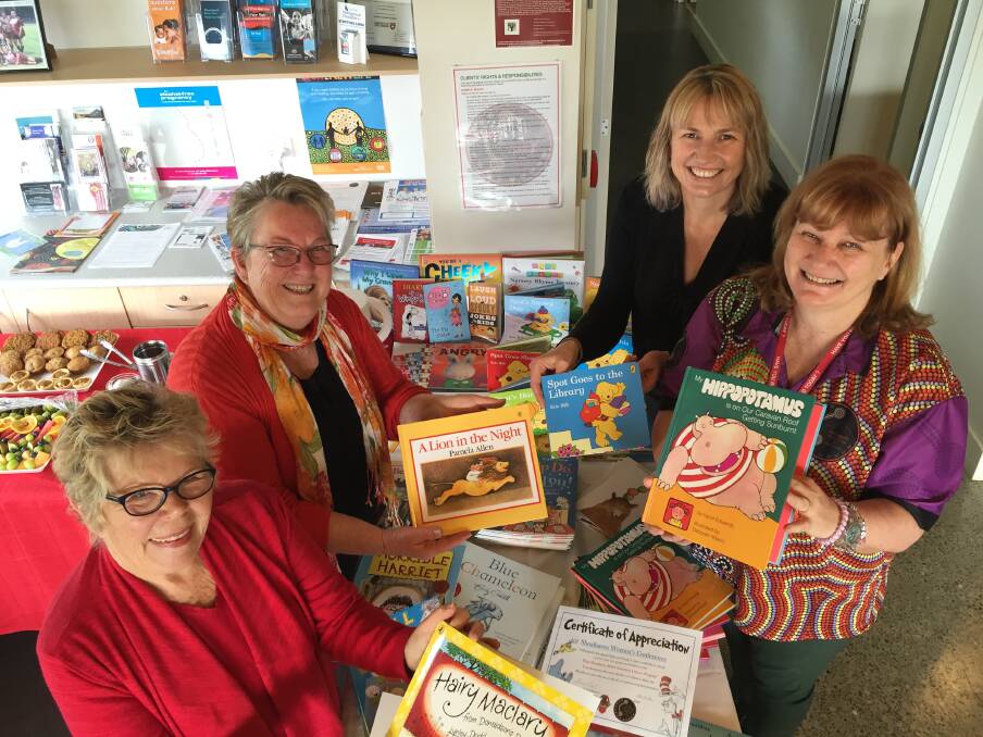 LOVING LITERATURE: Lynette Kearney, Linda Marquis, Penni Wildi and Tracey Kirk-Downey at a morning tea for the organisations that support Cullunghutti Aboriginal Child and Family Centre's Paint The Town REaD project.