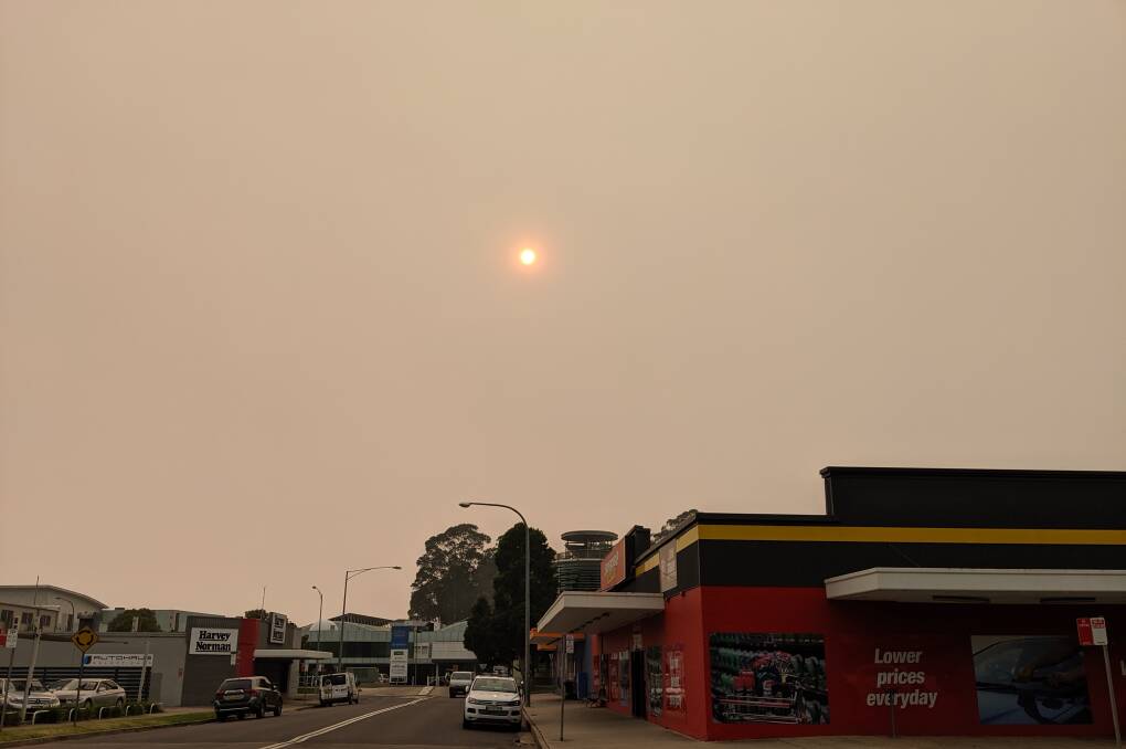 The sky remains smokey in Batemans Bay as fire conditions deteriorate on December 30.