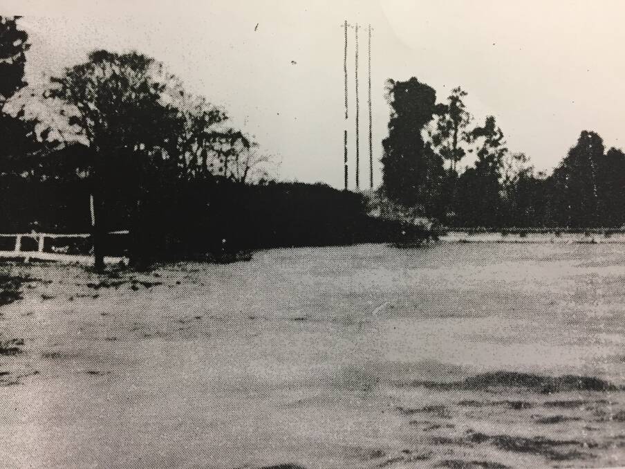WHITE OUT: Paper pulp whitened the Shoalhaven River in 1971 as far as the Nowra Bridge. Photo: Shoalhaven Historical Society. 