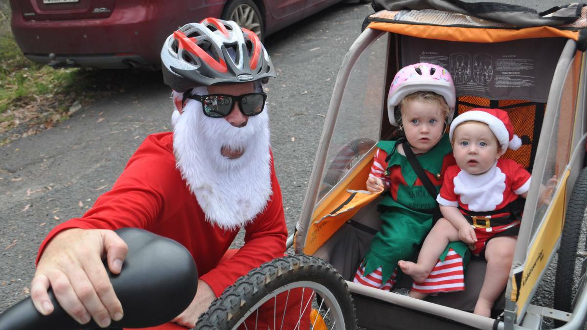 SANTAS IN TRAINING: Scott, Eadie and Angus Brown from Nowra take part in the 2017 event. 