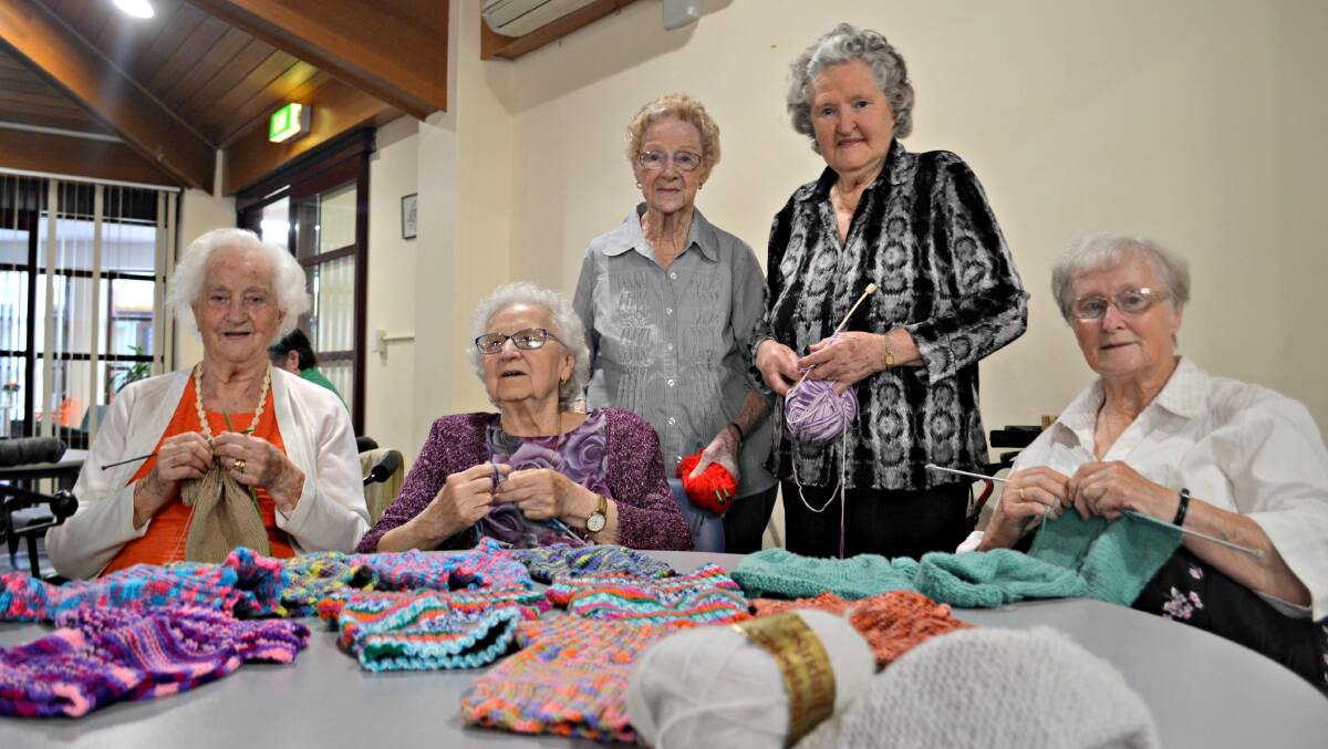 KNIT NATTER: Osborne House residents Audrey Boyd, Dorothy Scott, Vonnie Muller, Alice O'Neill and Pauline Nield knit, chat and laugh their way towards helping Uganda's 'fish and chip babies'.
