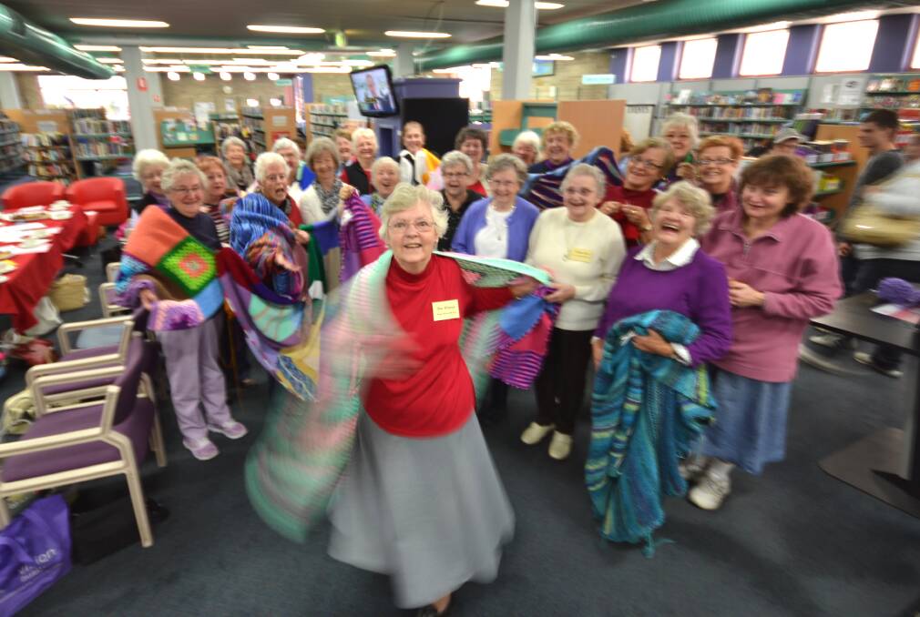 FRIENDSHIP AND KNITTING: Rae Watson (centre) started Wrap with Love in Nowra 11 years ago. The group welcomes everyone to its birthday celebrations on Tuesday, March 5. 