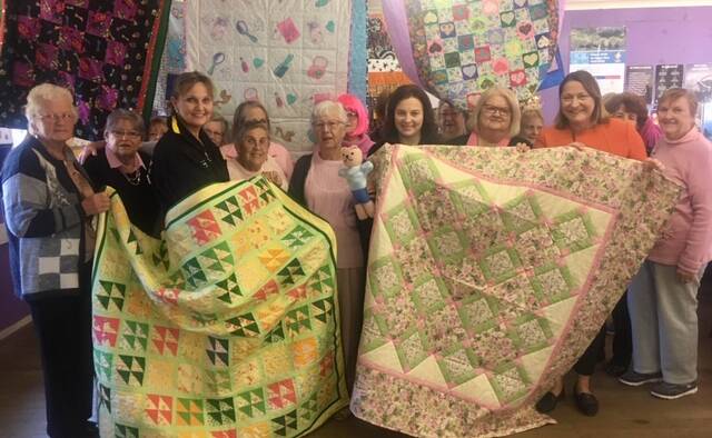 HANDMADE: The St Georges Basin Have a Chat Craft group donated beautiful quits to children's hospitals recently. Photo: supplied. 