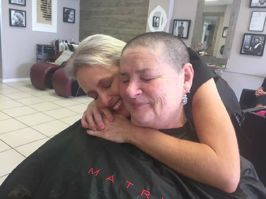 IN MEMORY: Marie Myers and hairdresser Kylie Halloran from Urban Hair. Marie shaved her hair to raise funds for cancer research and honour her friends and family lost to cancer. 