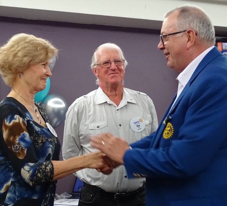 Peter Ford inducts Ray and Laurelle Price. Photo: supplied. 