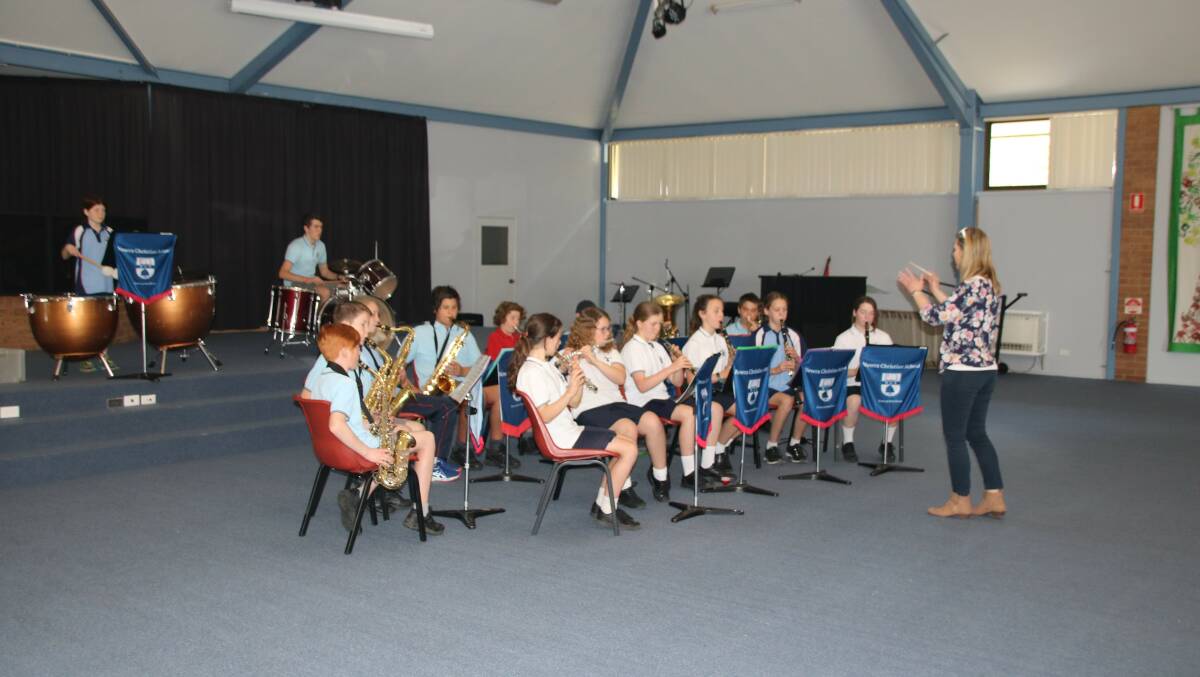 IMPRESSIVE: Students of the Nowra Christian School concert band with music teacher and conductress, Amanda Lawrence, who performed at the launch. Photo: contributed. 


