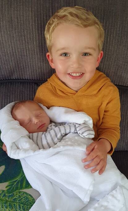 Proud big brother Flynn with new arrival, Oliver Green. Photo contributed.