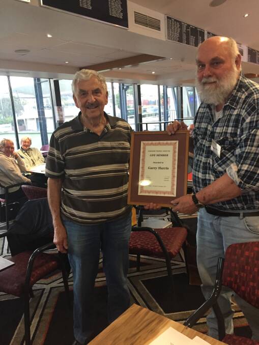 Garry Harris (left) is presented with Life Membership of the Shoalhaven Philatelic Society by president Andrew Gilliam.