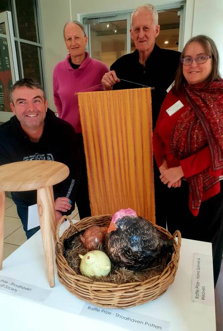 WIN IT: Charlie Hillen, Shoalhaven Woodcraft Society, Catriona McIvor, Shoalhaven Potters, Terry Hoffman, Shoalhaven Woodcraft Society and Rosemary Brigden, Nowra Spinners and Weavers, with the raffle prize. 