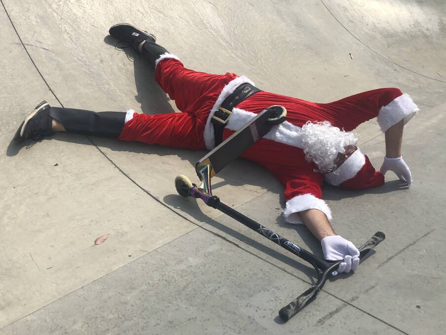 PIC OF THE DAY: Santa swaps the sleigh for the scooter in Culburra Beach. Photo by Alex McNeilly. Email photos to editor@southcoastregister.com.au 