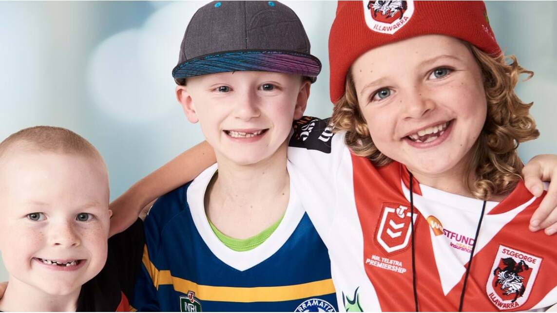 STAR: Jett (centre) is a Footy Colours Ambassador. His photo is now front and centre on the Fight Cancer Foundation Footy Colours Day website. Photo: fightcancer.org.au