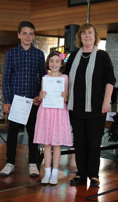 Dejan Kanazir and Amelie Ziino Equal Winners Junior Classical receive their awards from Catherine Dale, General Manager Eurobodalla Shire Council. Photo: contributed. 