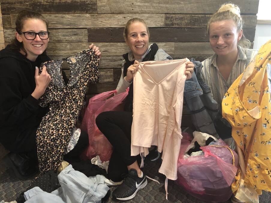 DECKED OUT: Cynthia King, Kriselle Izard, and Tiffany Rowcroft are accepting clothing donations ahead of August's Beyond the Clothes Swap. Photo: supplied. 