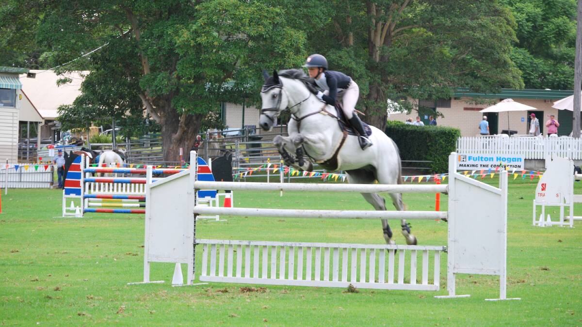 FULL FLIGHT: Jamie Priestley on course at last year's Berry Show. This year's show will again feature a packed two-day horse program. 