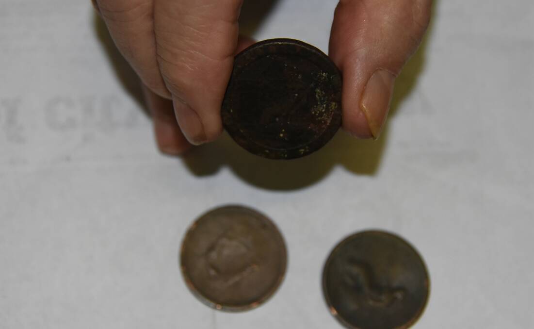 A coin from 1737 (in hand) and two from the early 1800s make up a local man's valuable coin collection. 