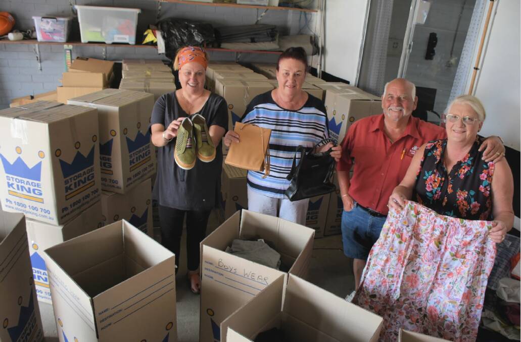 GENEROUS: Gail Neuss, Kay Forster and Ken and Sue Davies package the hundreds of donated items. 